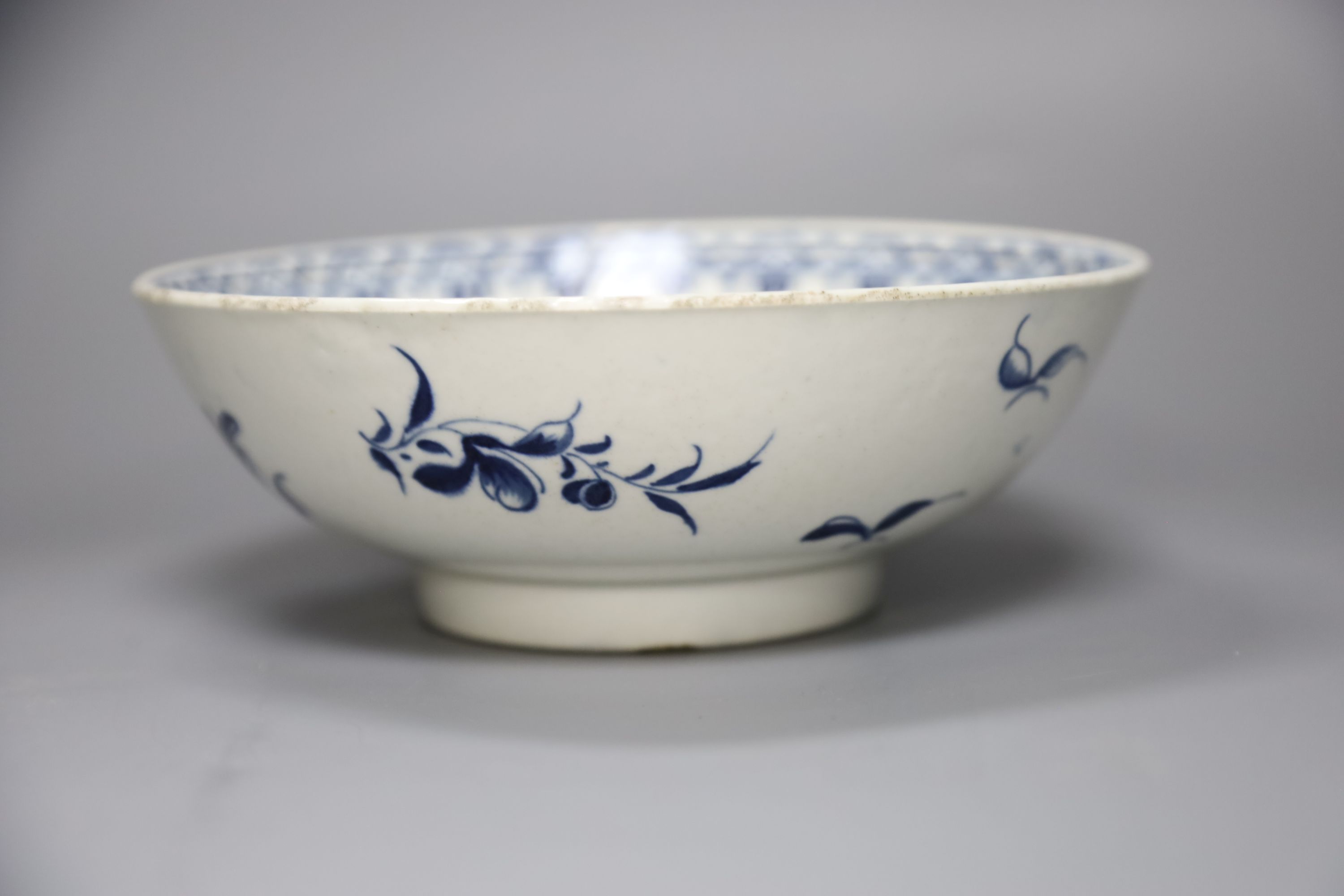 An 18th century Worcester bowl painted with the Peony pattern in blue, Workmans mark in blue to base, diameter 19cm